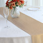 Blush shimmer sequin table runner on a white table with floral arrangement.