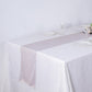 Beige shimmer sequin dots polyester table runner on a white table.