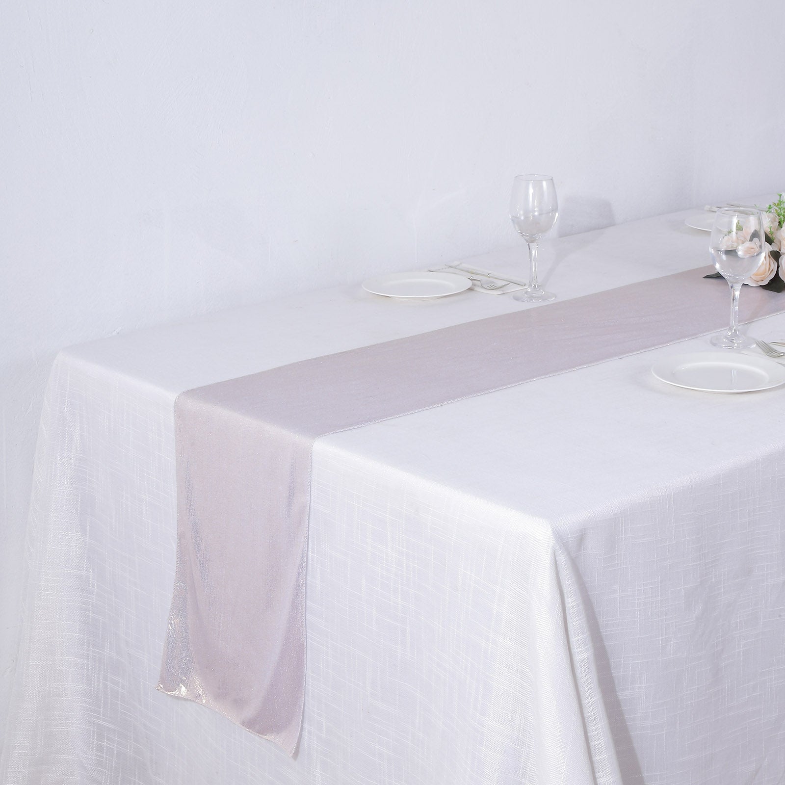 Beige shimmer sequin dots polyester table runner on a white table.
