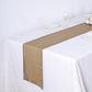 Antique gold shimmer sequin table runner on a white table.
