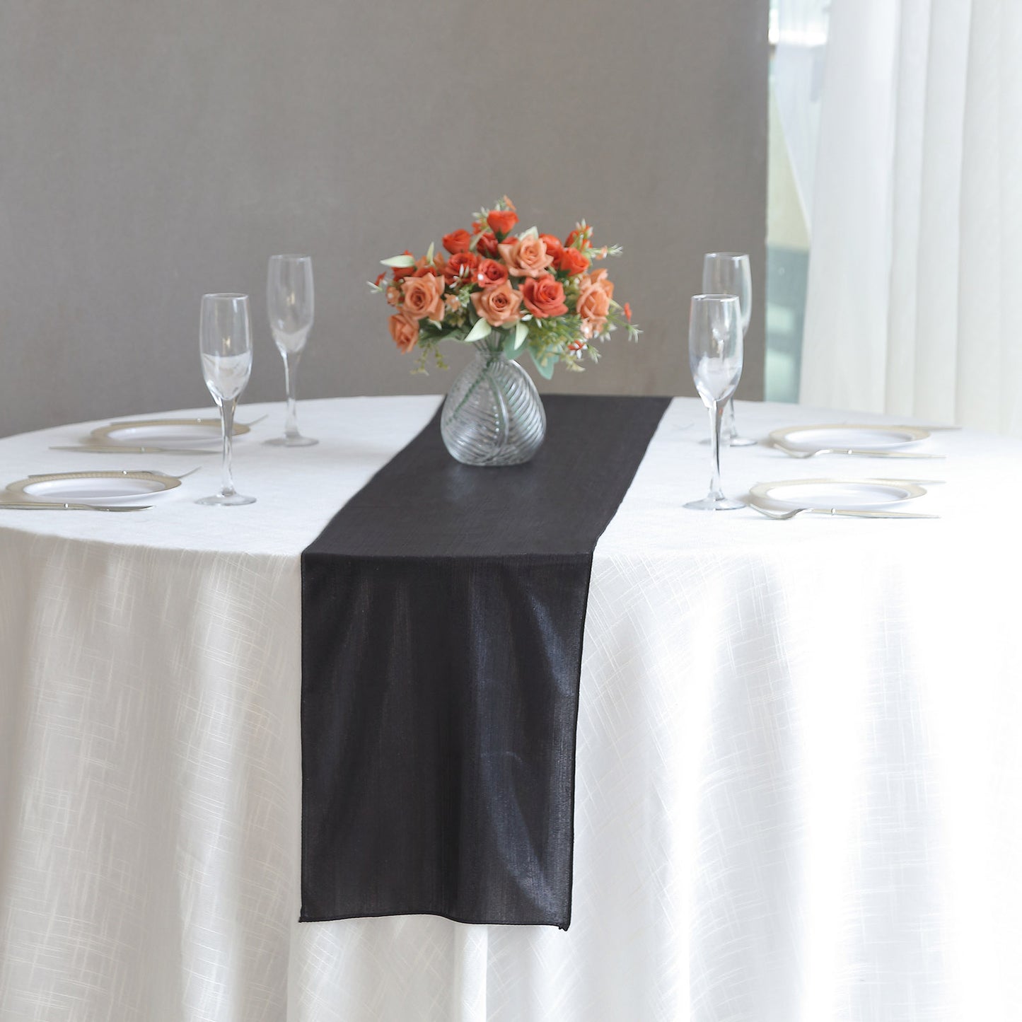Black shimmer sequin table runner for elegant dining decor.