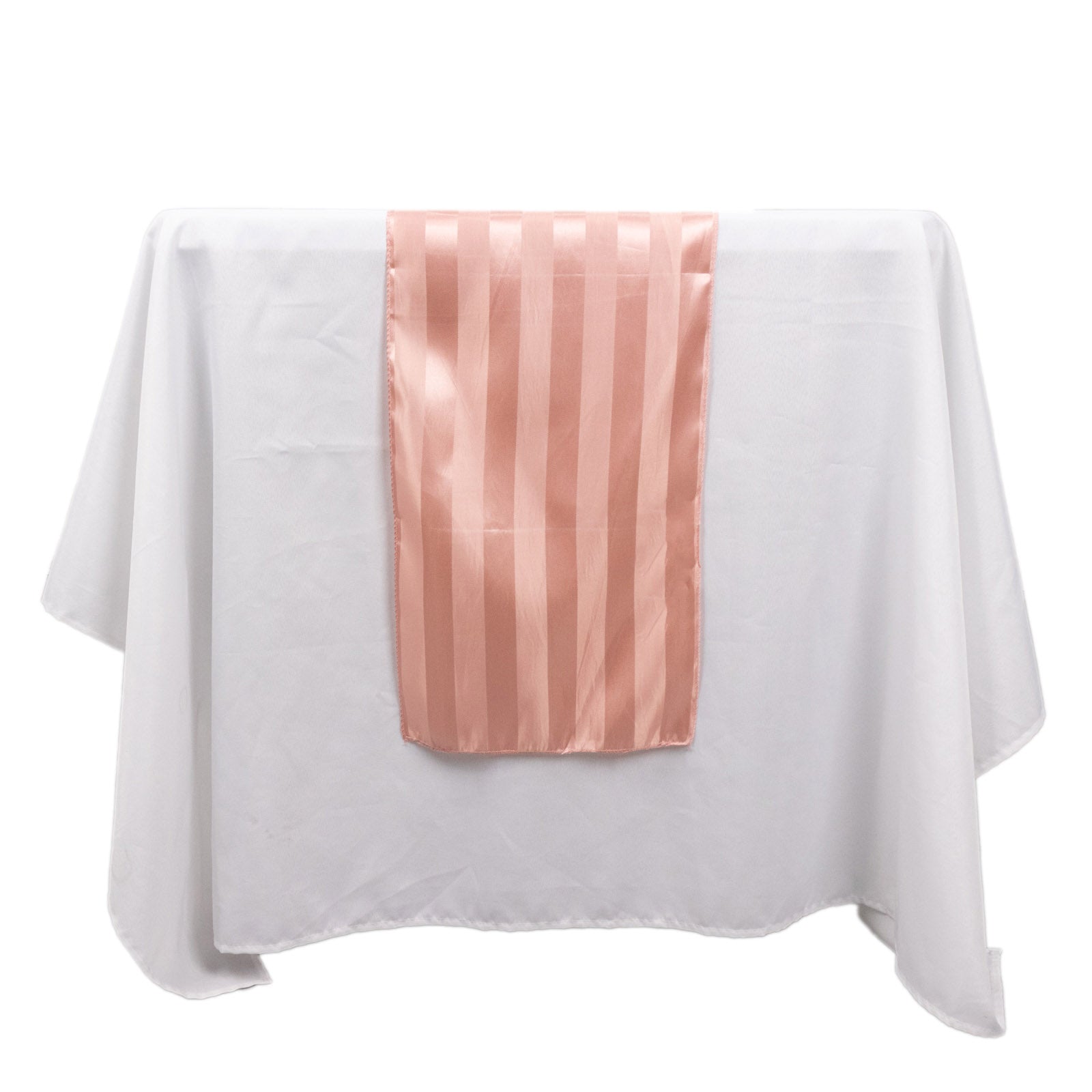 Dusty rose satin stripe table runner on a white tablecloth.