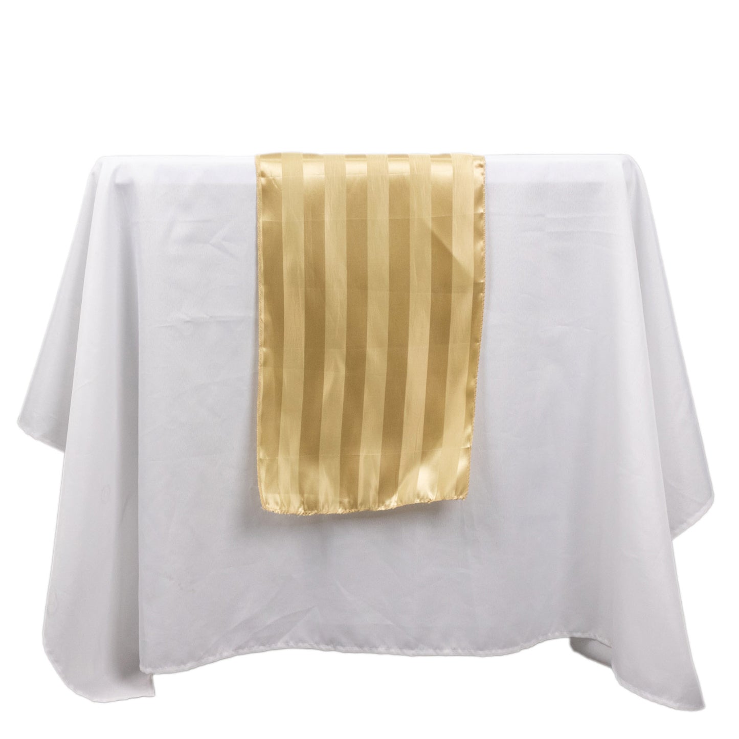 Champagne satin stripe table runner on a white tablecloth.