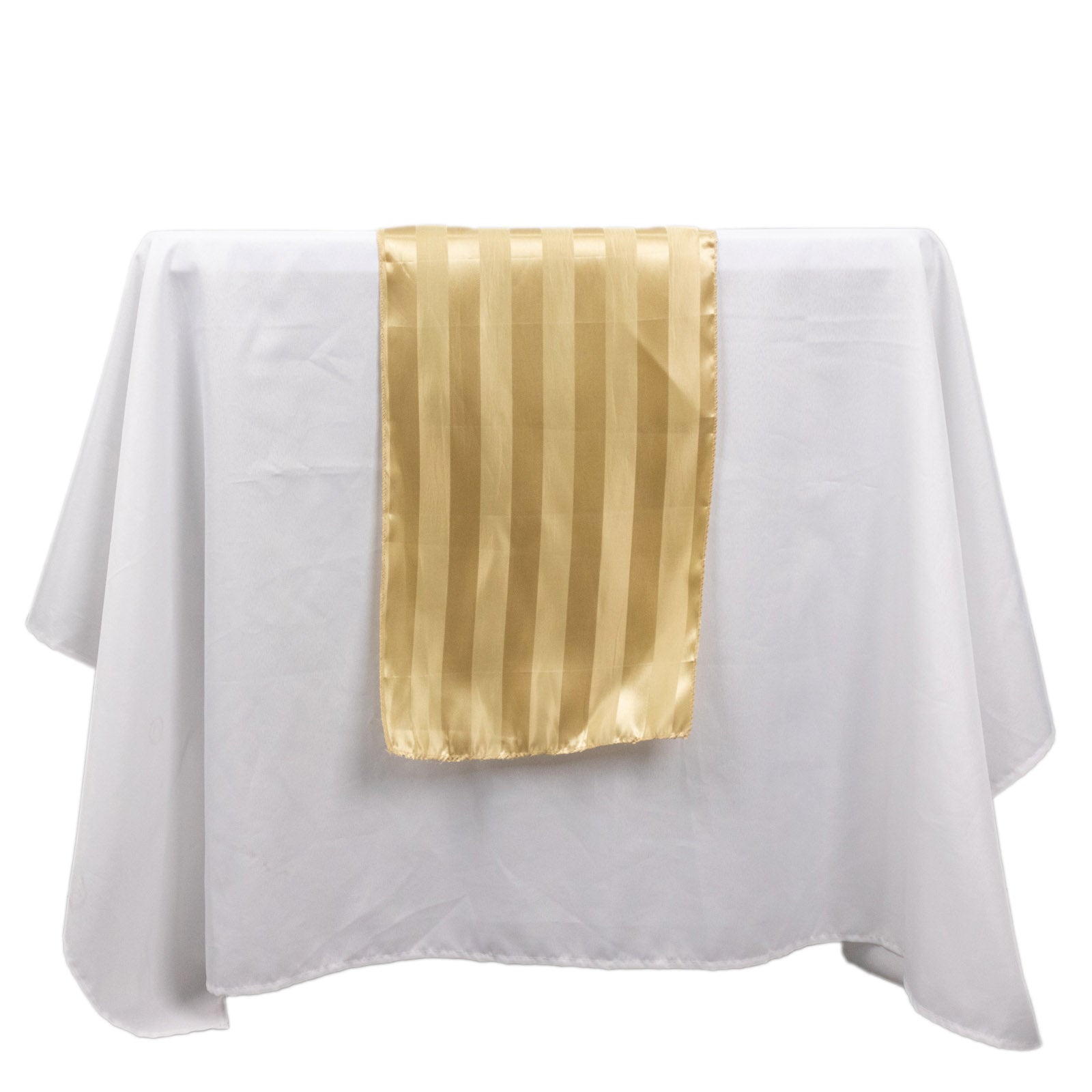 Champagne satin stripe table runner on a white tablecloth.