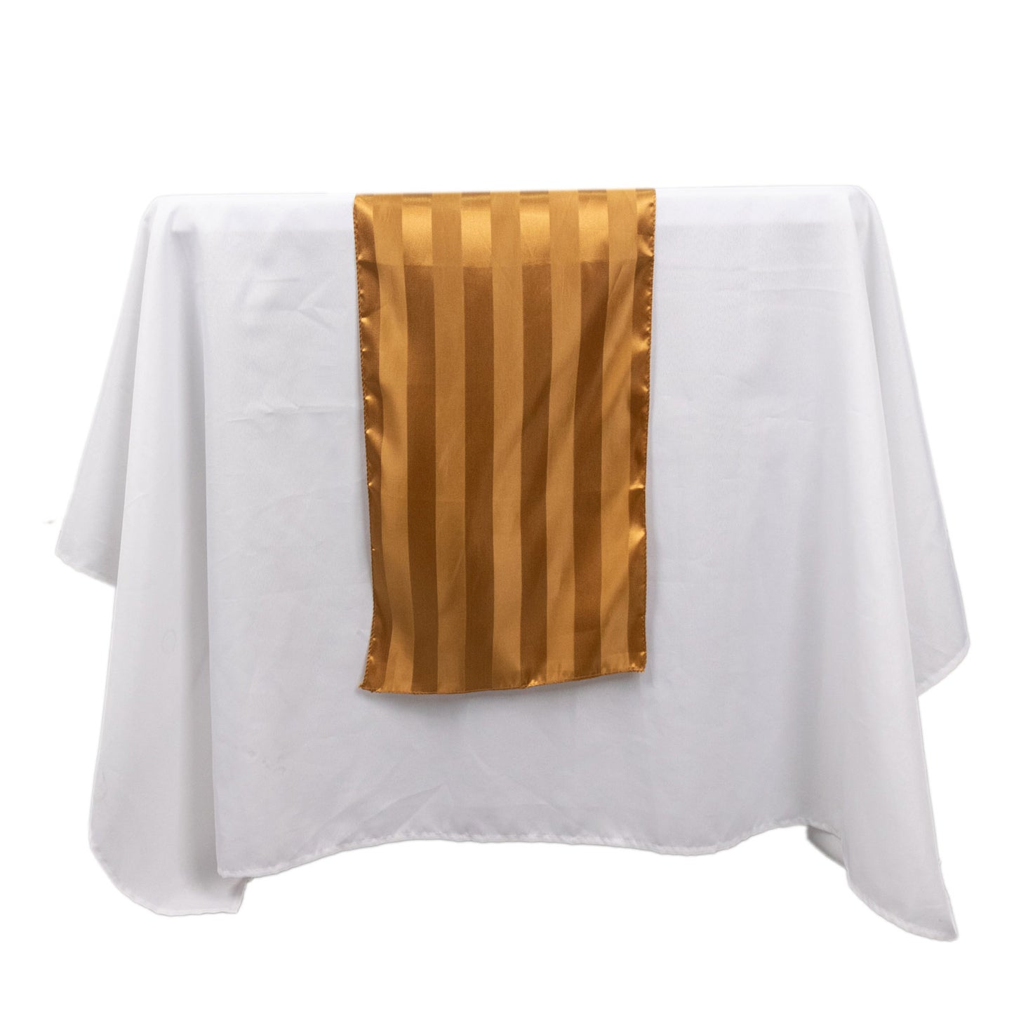 Gold satin stripe table runner on a white tablecloth.