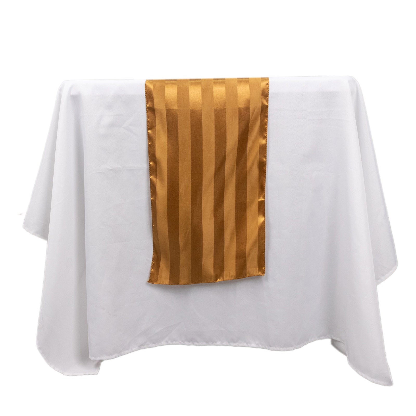 Gold satin stripe table runner on a white tablecloth.