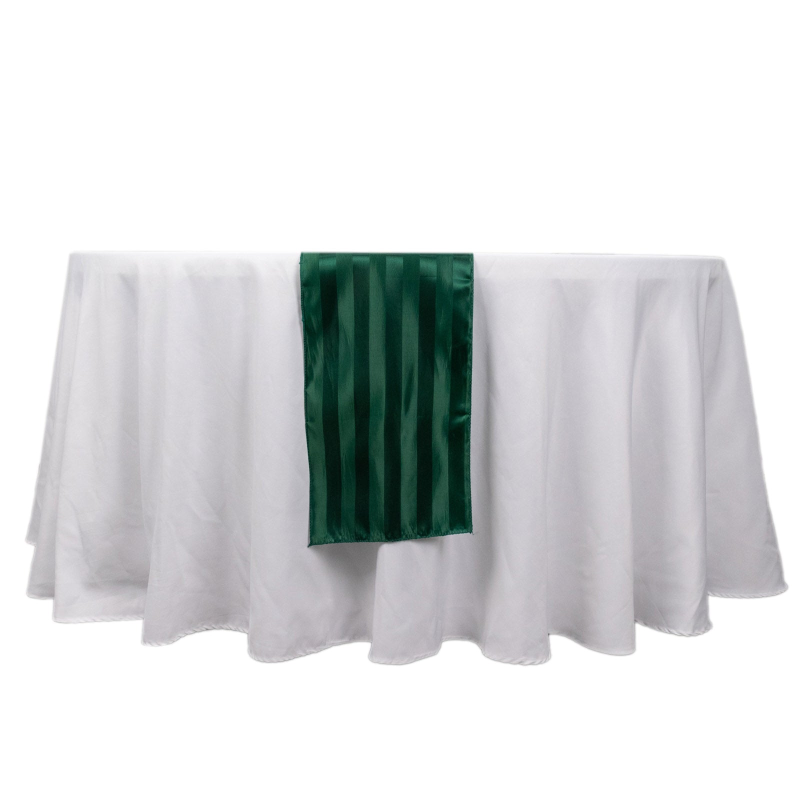 Hunter emerald green satin stripe table runner on a white tablecloth.