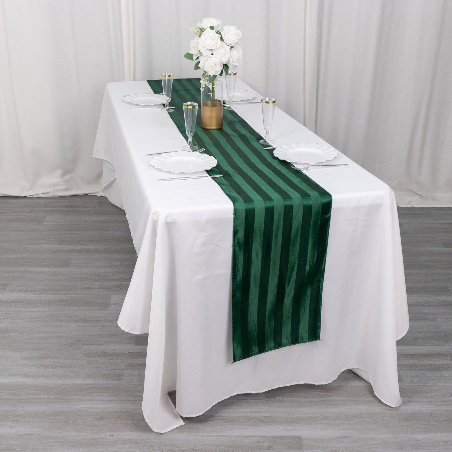 12"x108" Hunter Emerald Green Satin Stripe Table Runner on a white table.