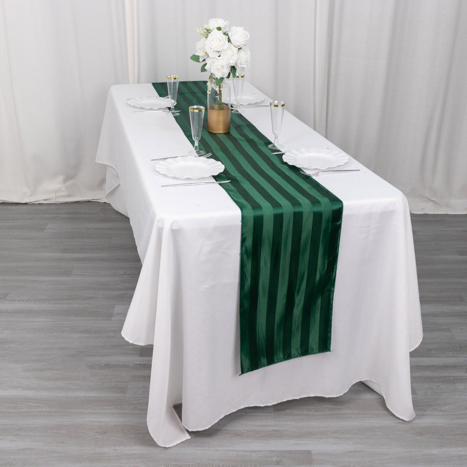 12"x108" Hunter Emerald Green Satin Stripe Table Runner on a white table.