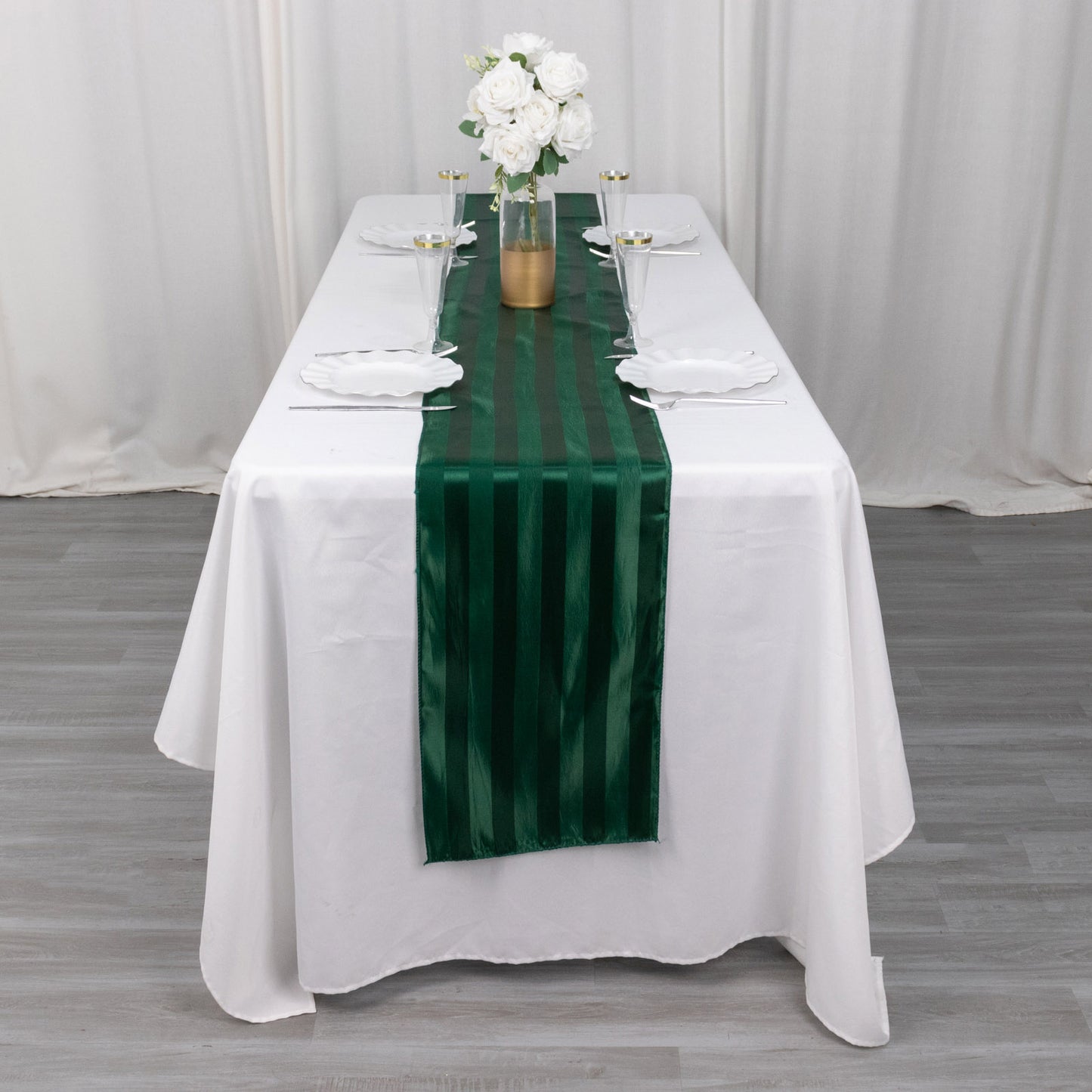 Hunter Emerald Green Satin Stripe Table Runner on a white tablecloth.