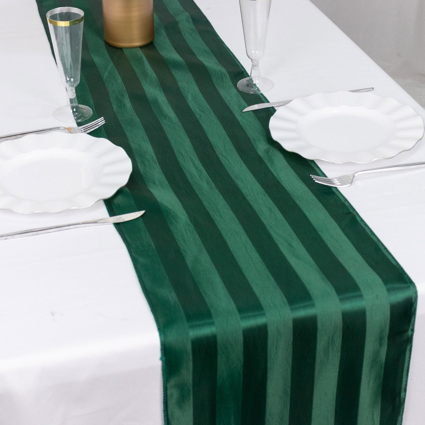 Hunter Emerald Green Satin Stripe Table Runner on a white table.