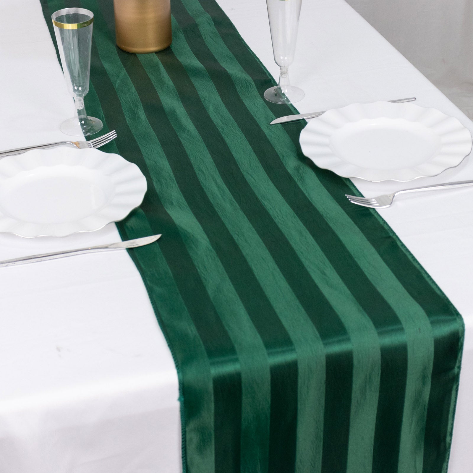 Hunter Emerald Green Satin Stripe Table Runner on a white table.