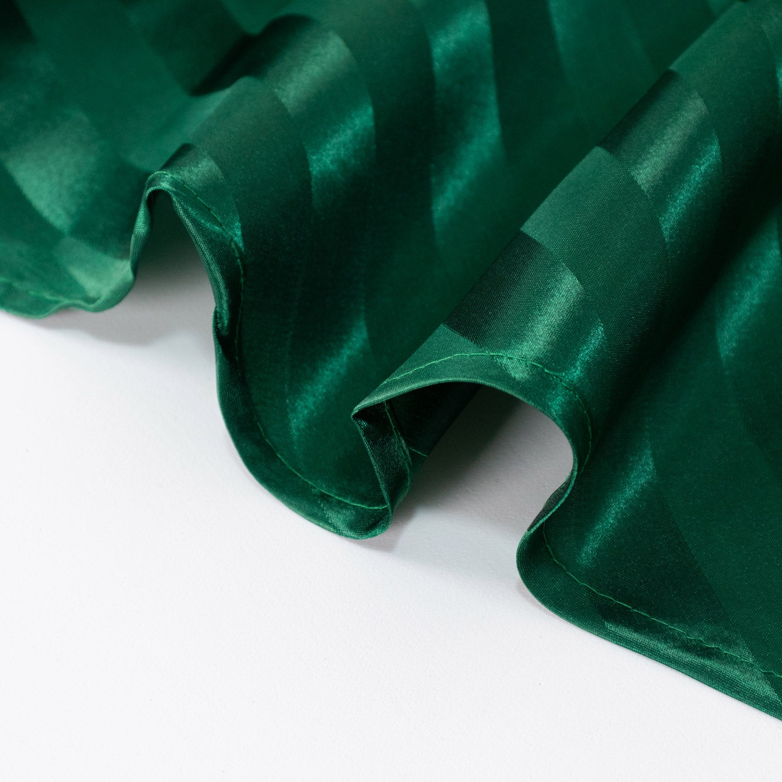 12"x108" Hunter Emerald Green Satin Stripe Table Runner on a white surface.