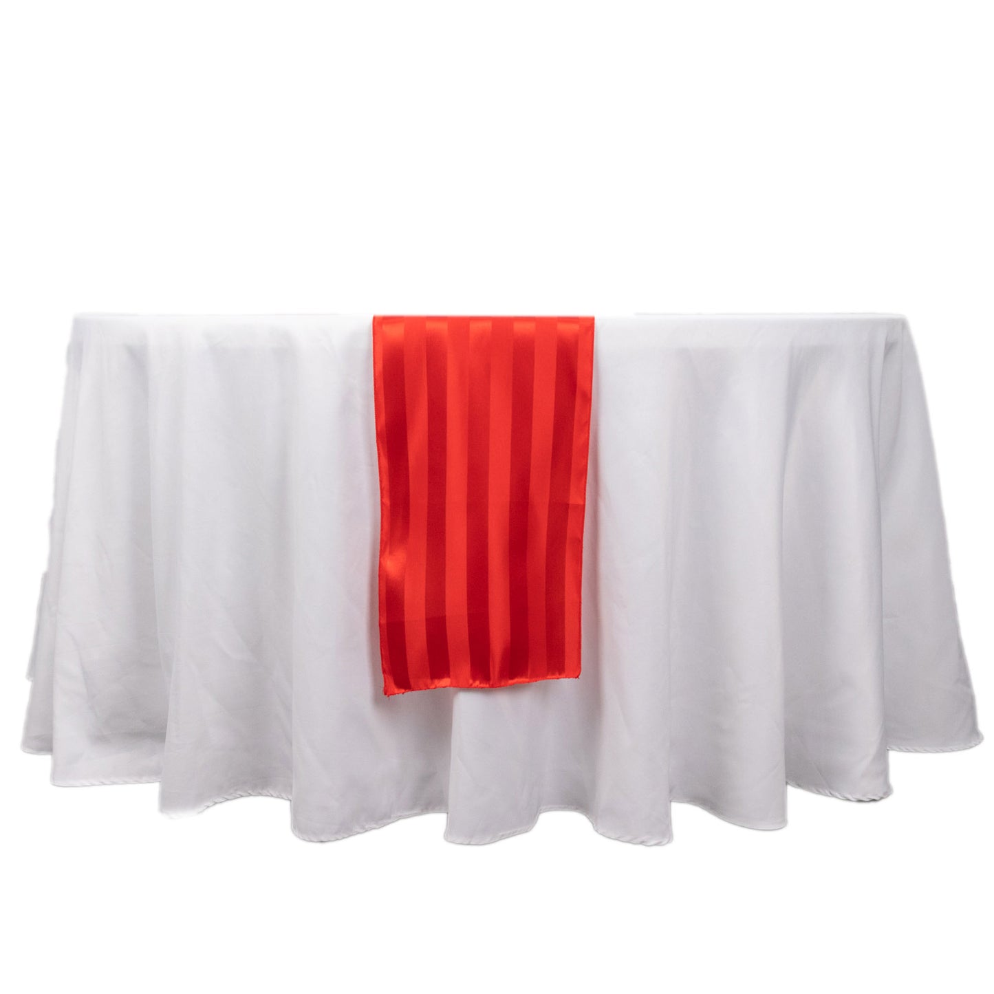Red satin stripe table runner on a white tablecloth.