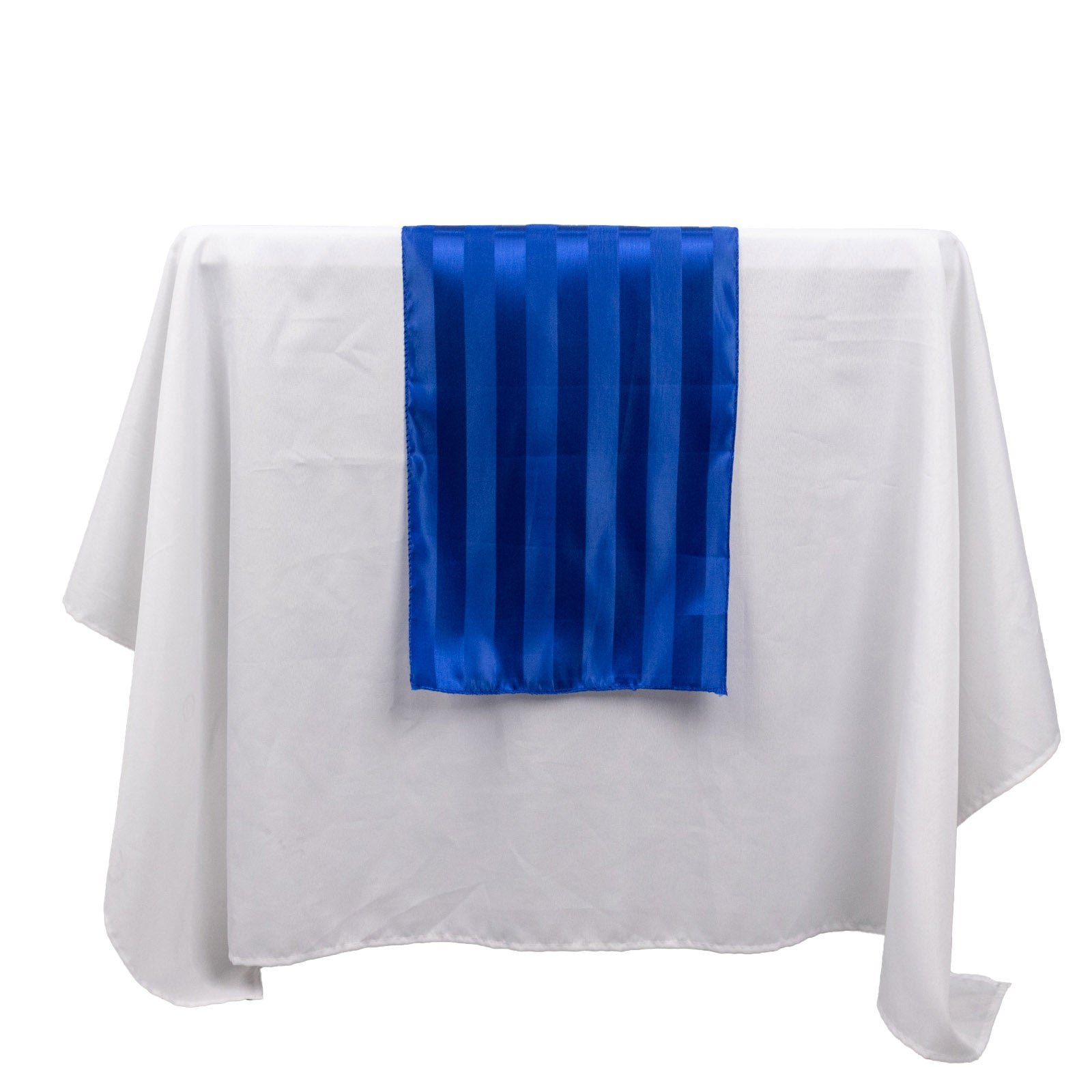 Royal blue satin stripe table runner on a white tablecloth.