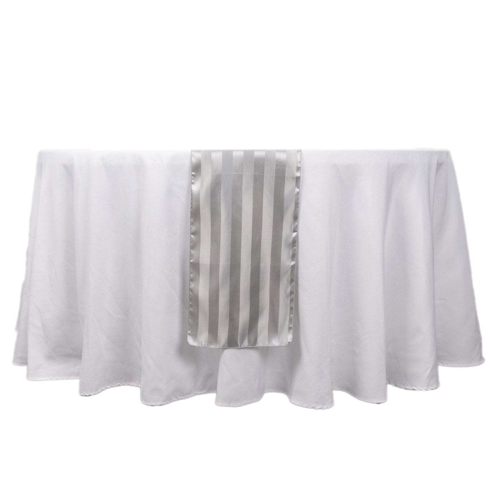 Silver satin stripe table runner on a white tablecloth.