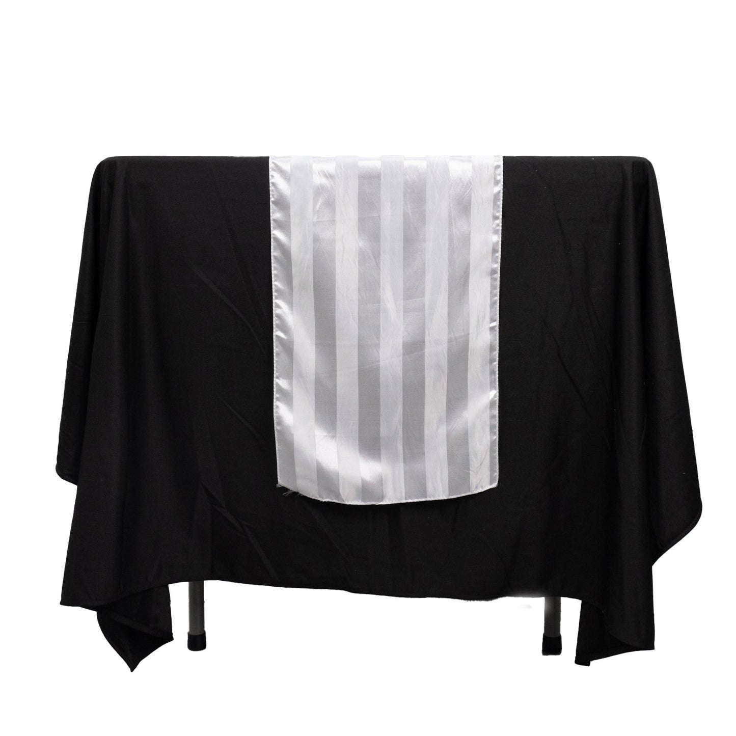 White satin stripe table runner on a black tablecloth.