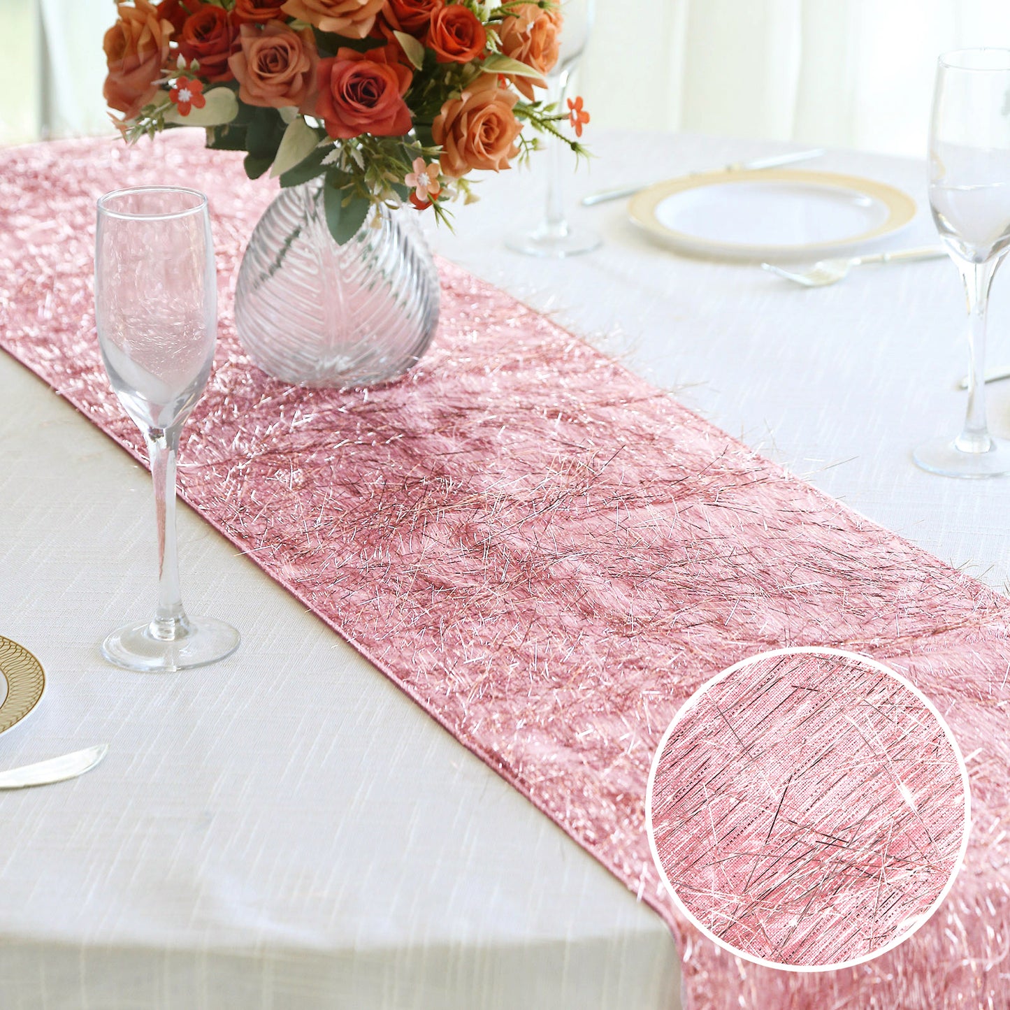 Rose gold metallic fringe tinsel table runner on a dining table.