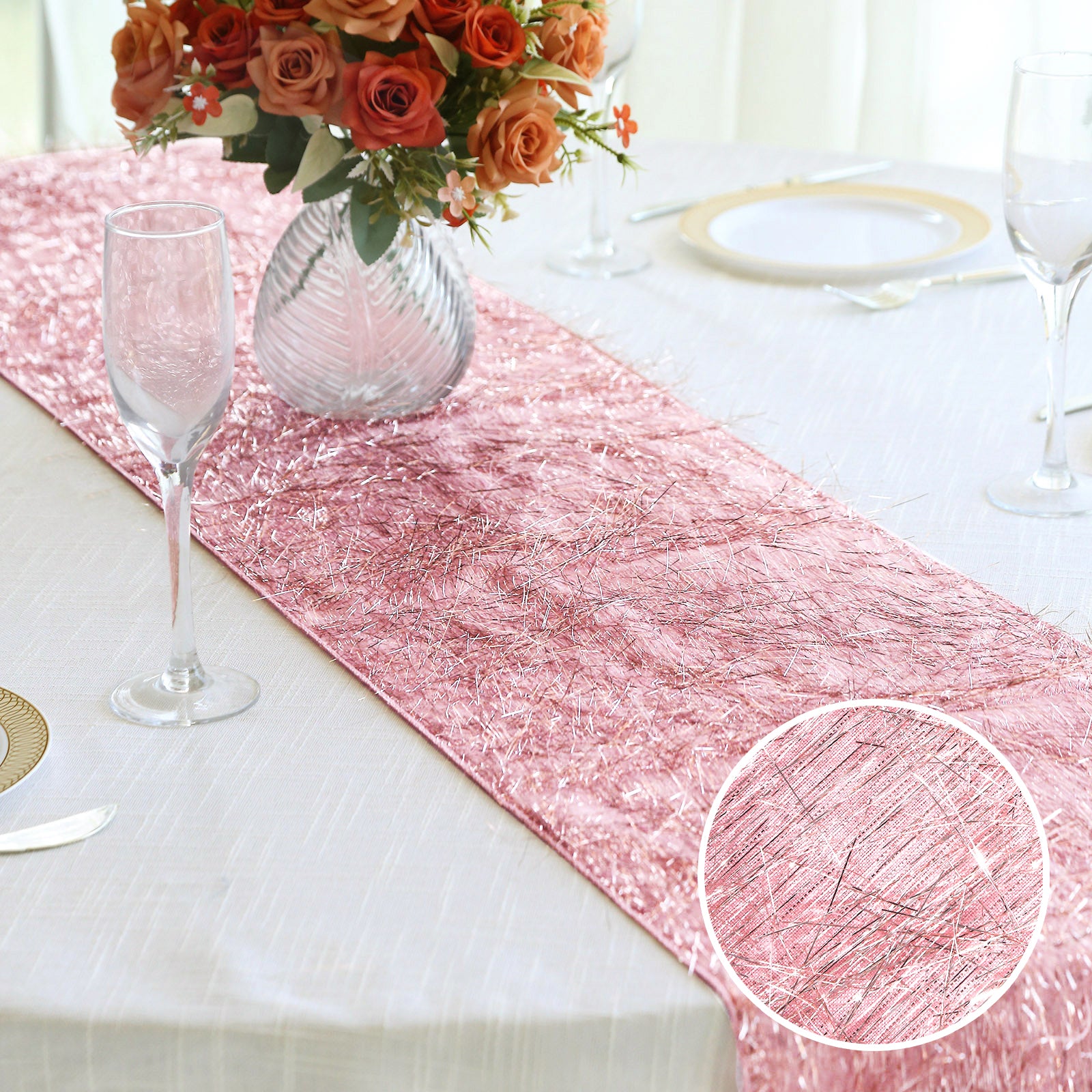 Rose gold metallic fringe tinsel table runner on a dining table.