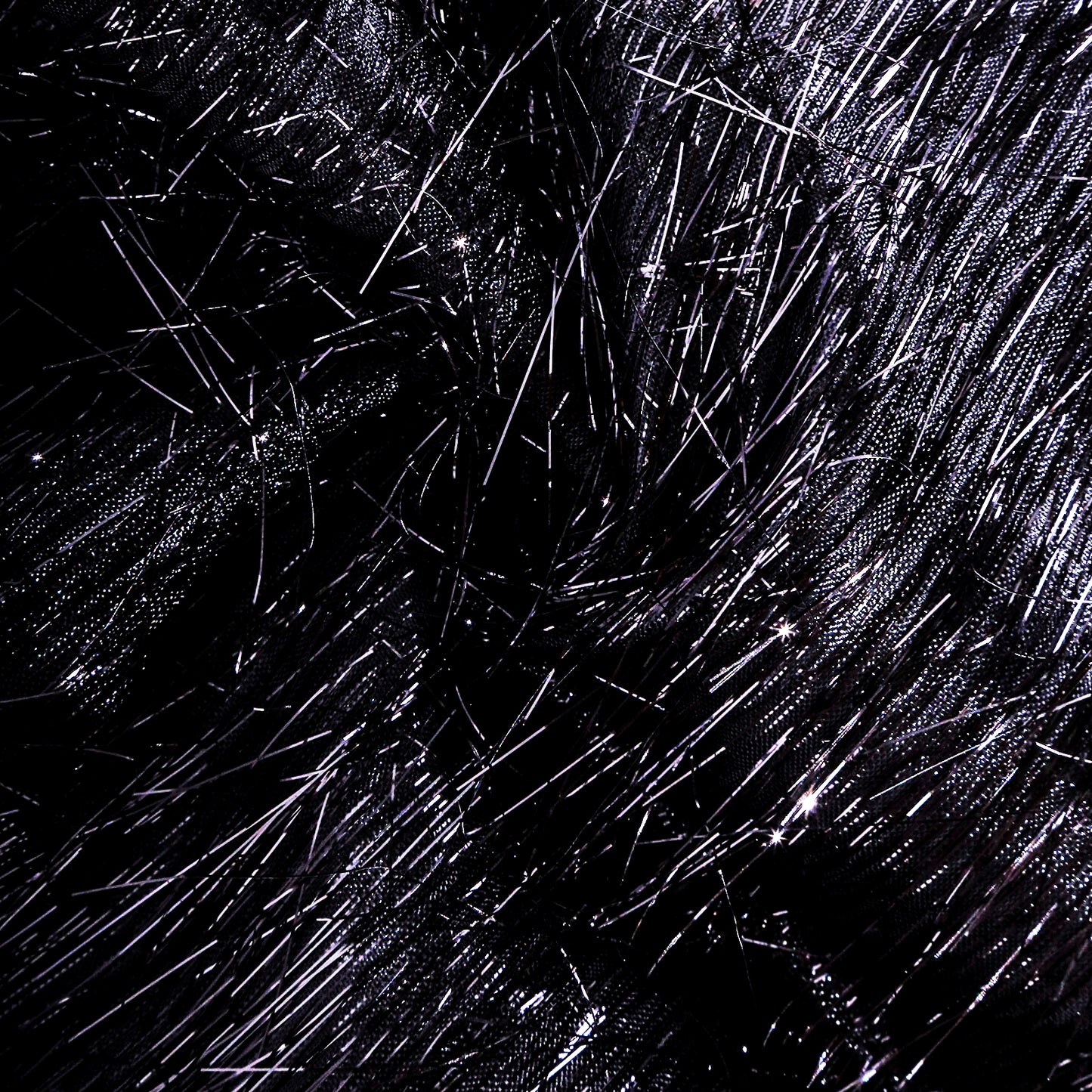 Black metallic fringe tinsel table runner with shimmery polyester finish.