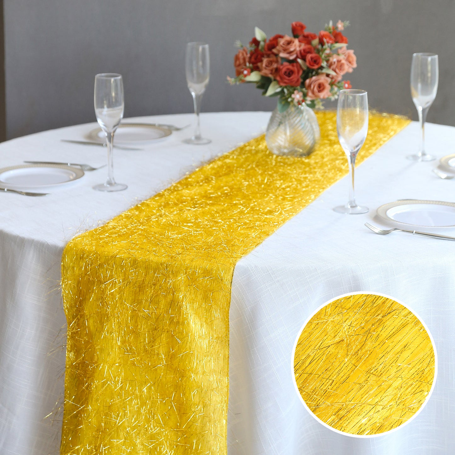 Gold metallic fringe table runner on a white tablecloth.