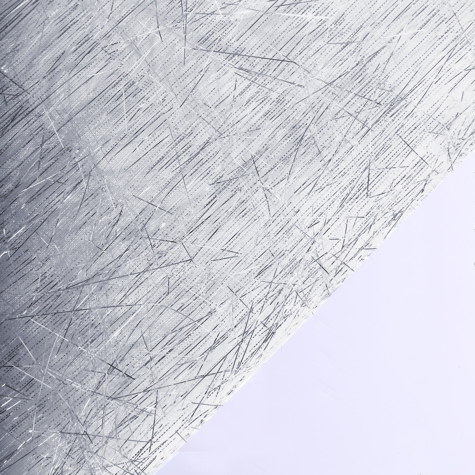 Silver metallic fringe tinsel table runner, 12"x108" in shimmery polyester.