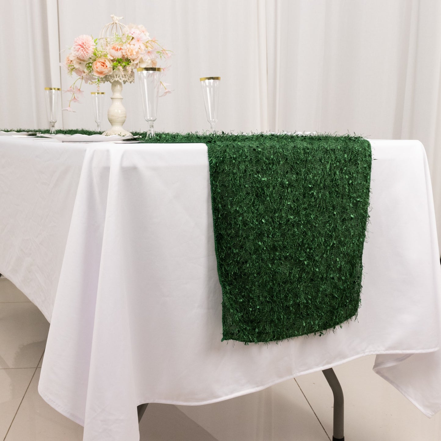 Green shag minky polyester table runner on a white table.