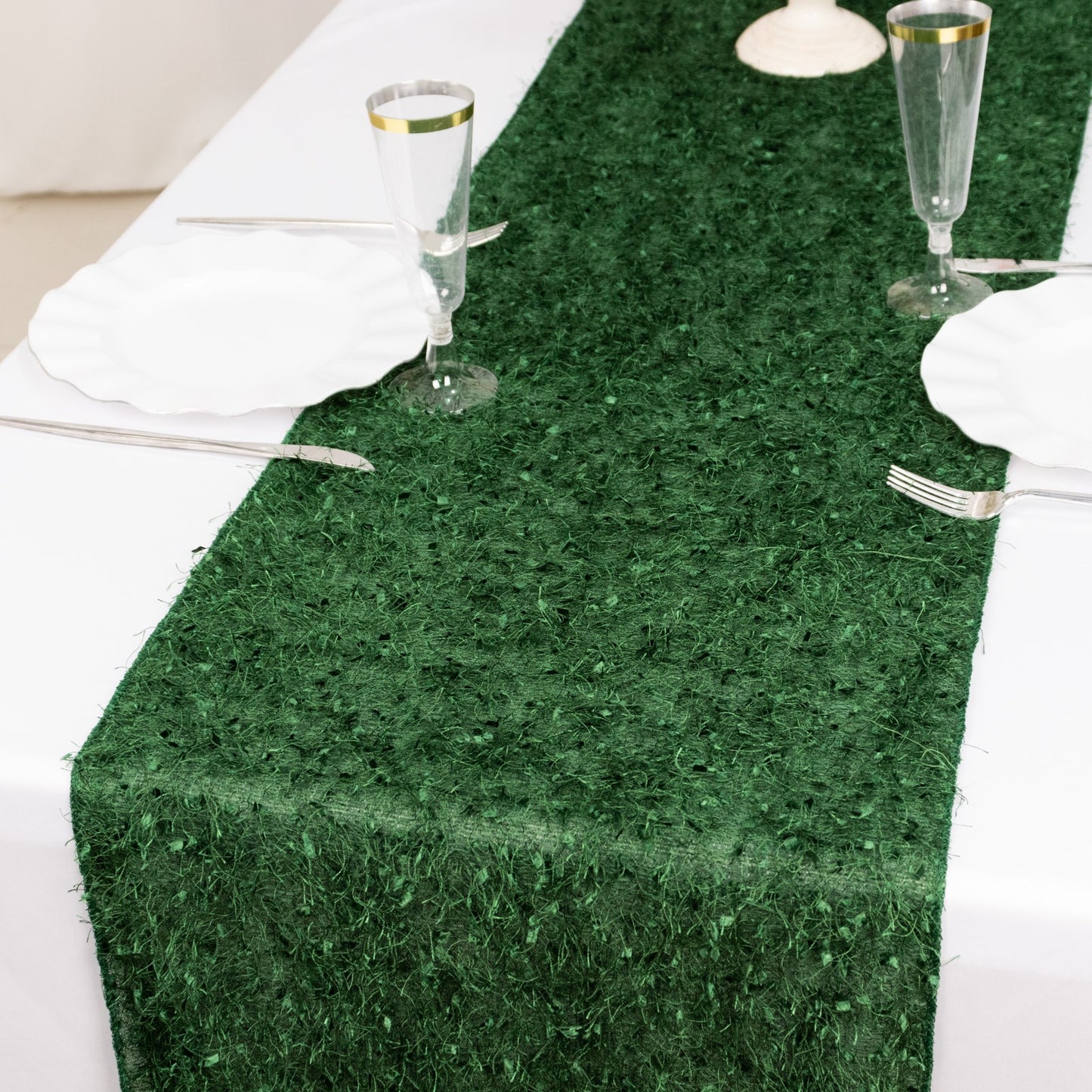 Green shag minky polyester table runner on a white table setting.