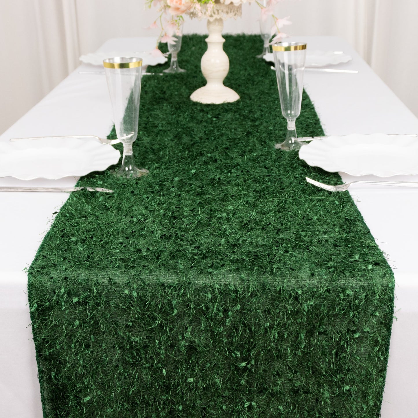 Green shag minky polyester table runner on a white table setting.