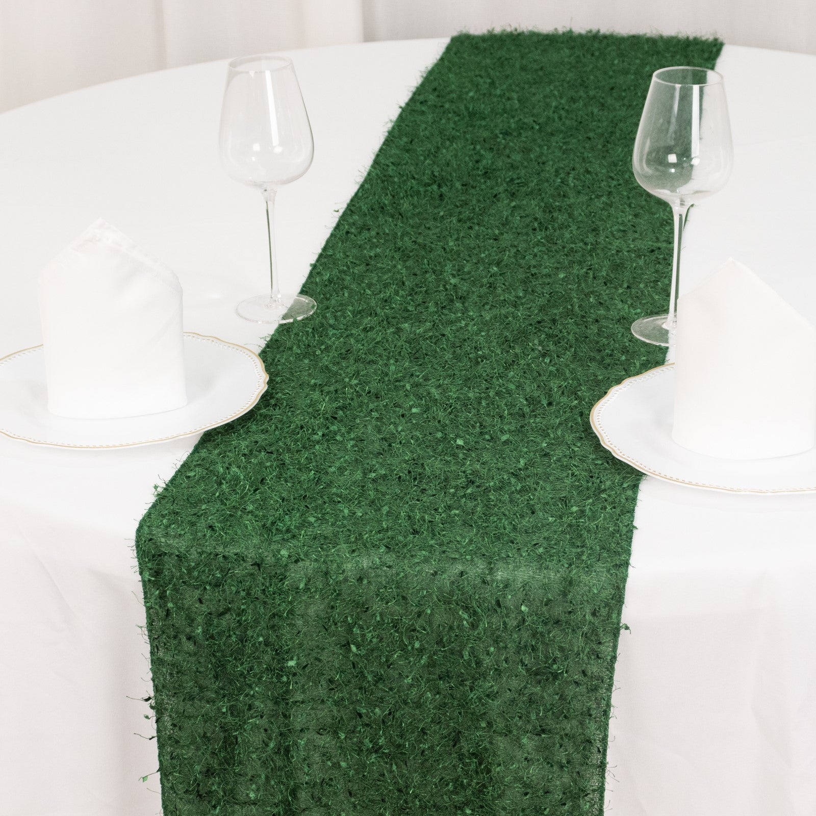 Green shag minky polyester table runner on a white table setting.