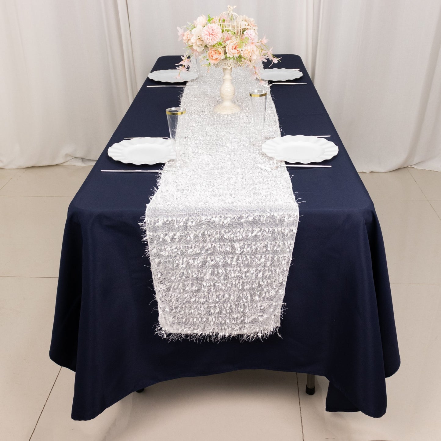 White shag minky polyester table runner on a navy blue table.
