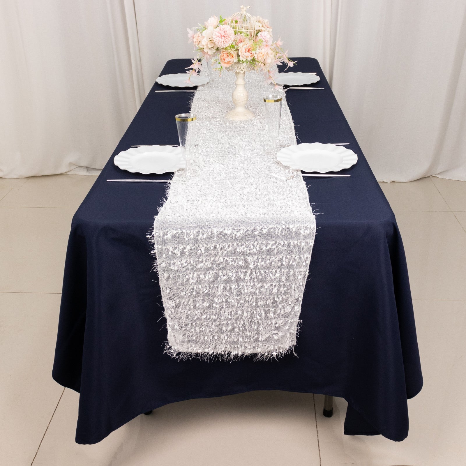 White shag minky polyester table runner on a navy blue table.