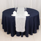 White shag minky polyester table runner on a navy blue table.