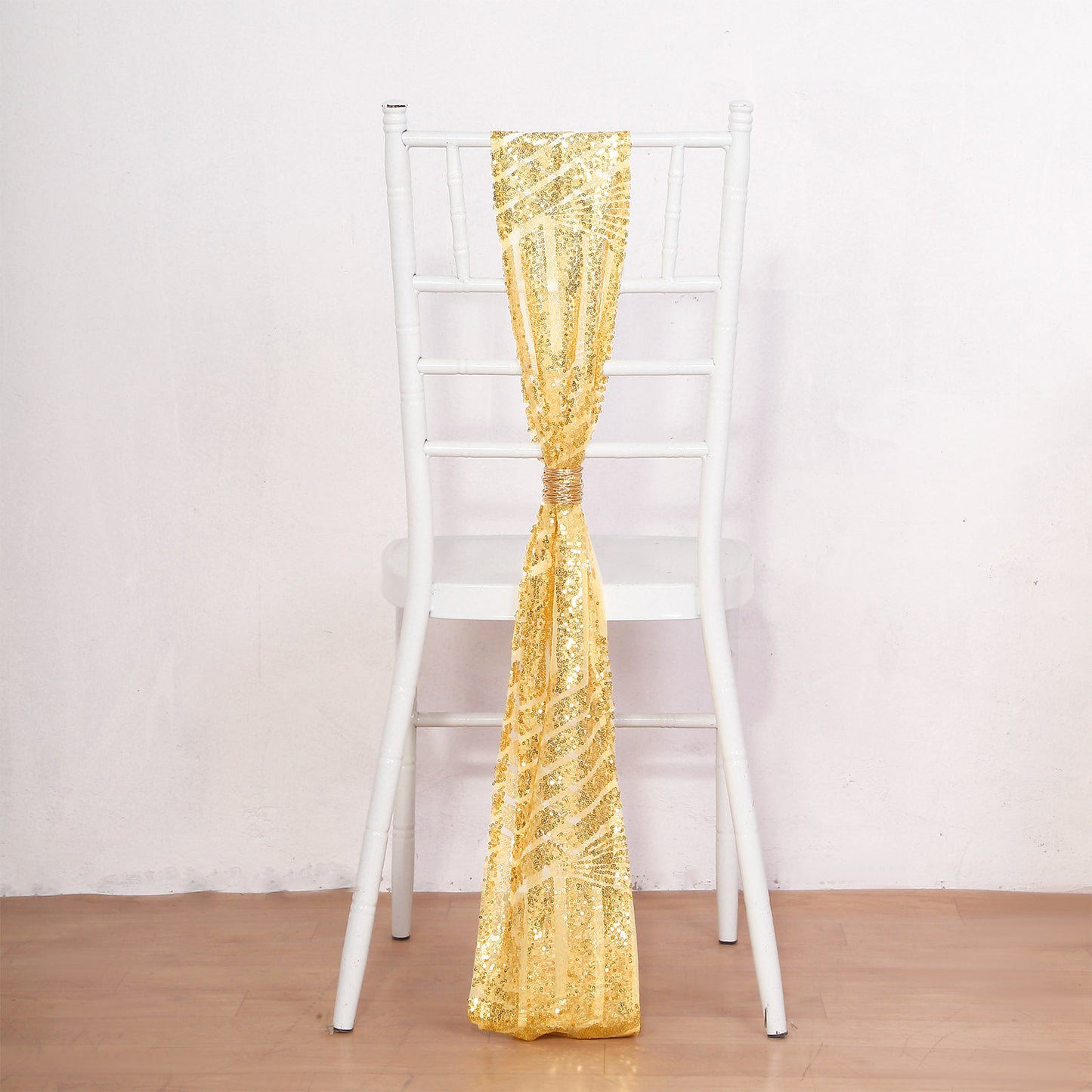 Gold Geometric Diamond Sequin Chair Sash on a white chair.