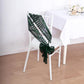 Emerald green geometric diamond glitz sequin chair sash on a white chair.
