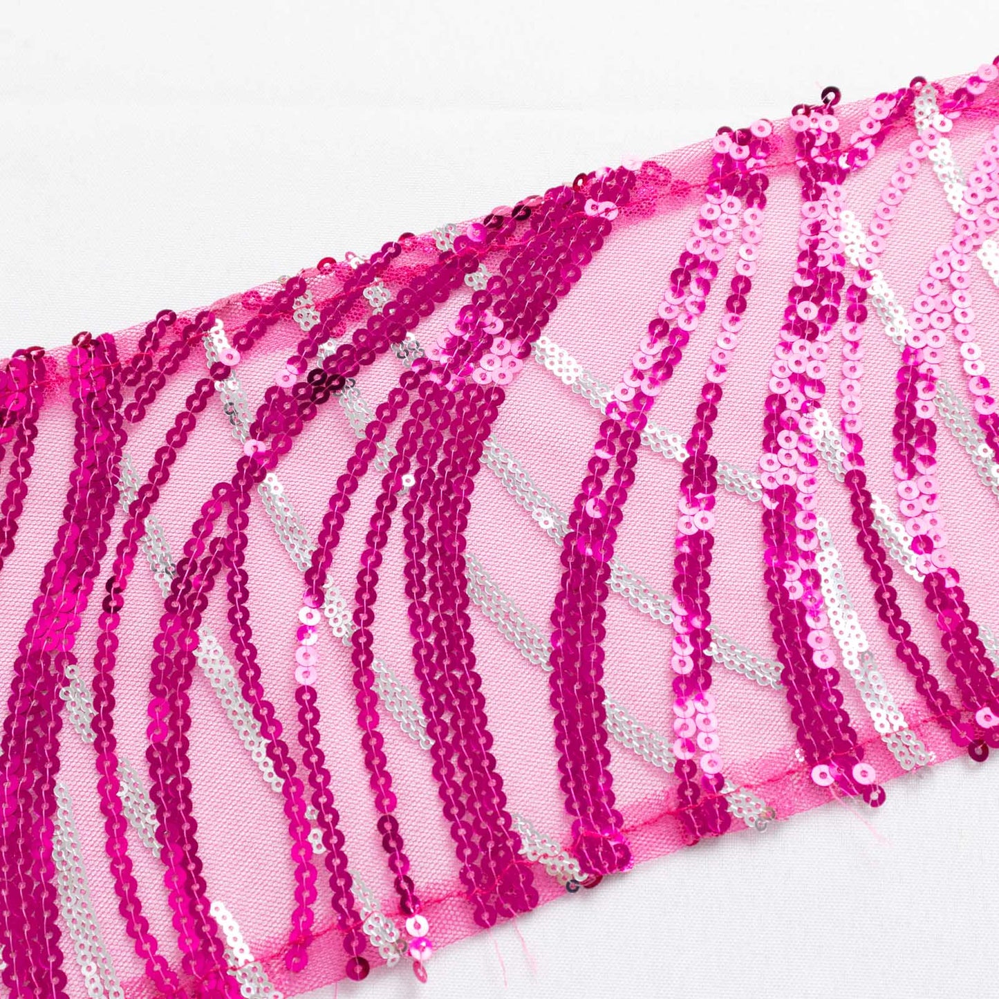 Fuchsia silver wave embroidered sequin mesh chair sashes.