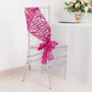 Fuchsia sequin mesh chair sash draped elegantly on a clear chair.