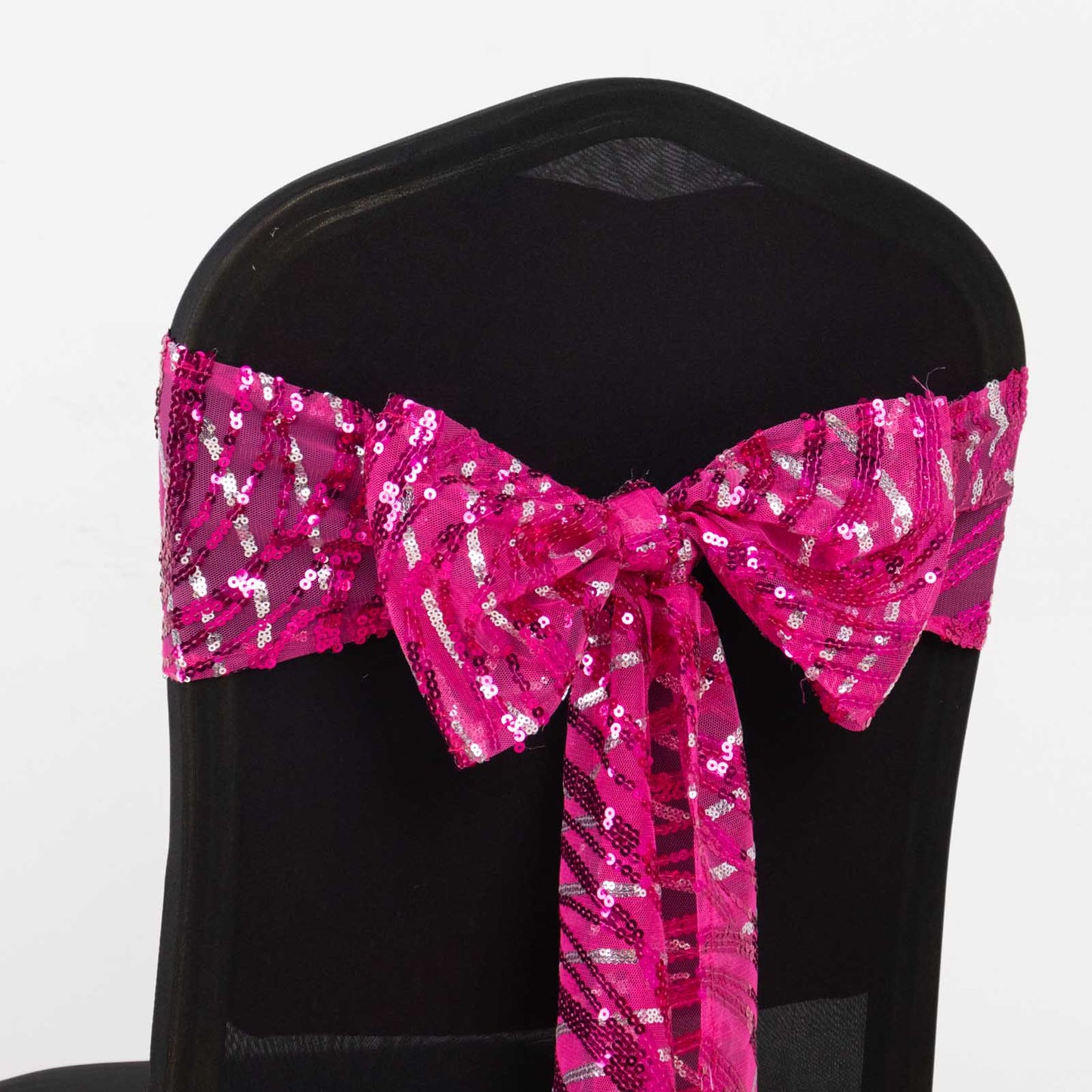 Fuchsia sequin mesh chair sash with silver wave design.
