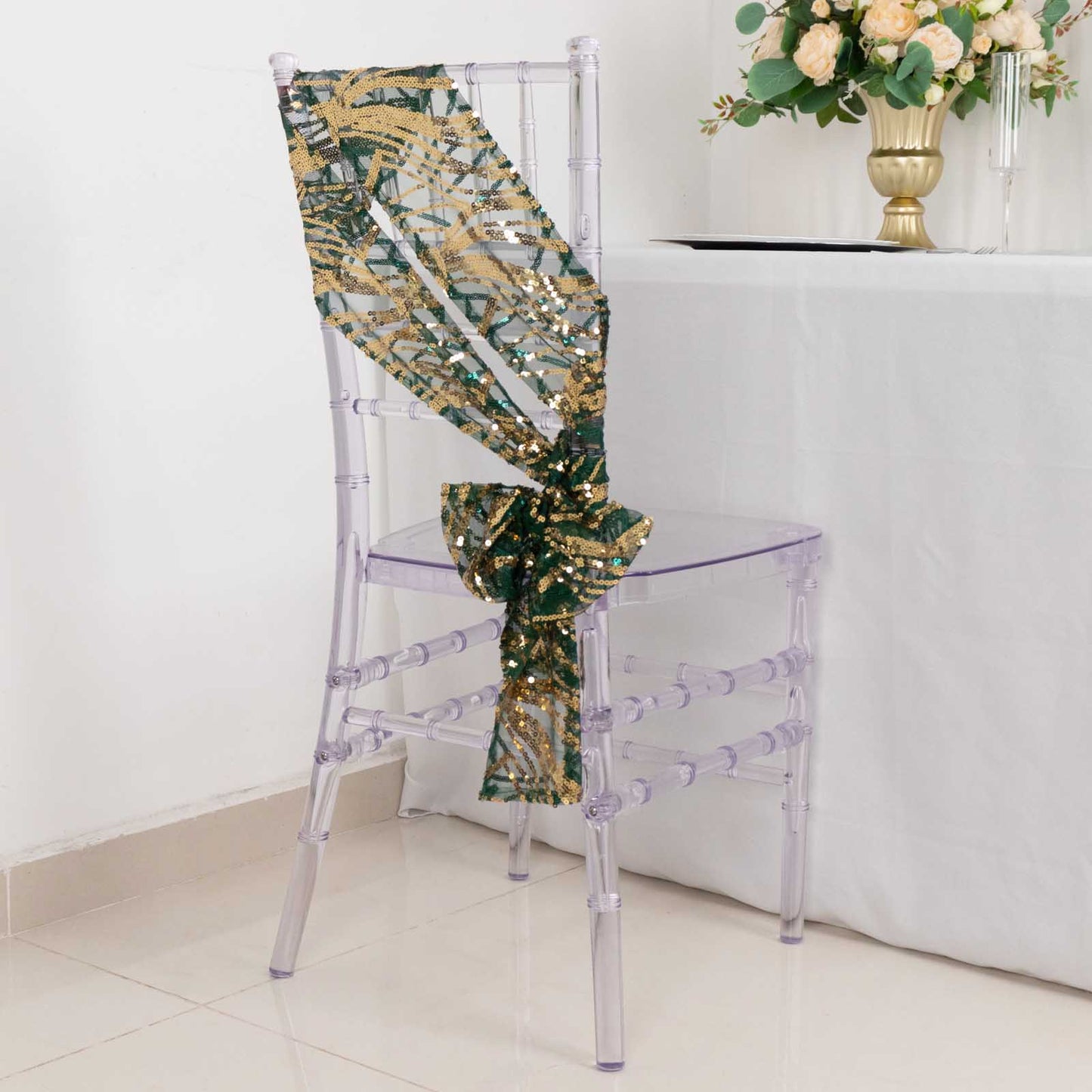 Hunter emerald green gold wave embroidered sequin chair sash on clear chair.