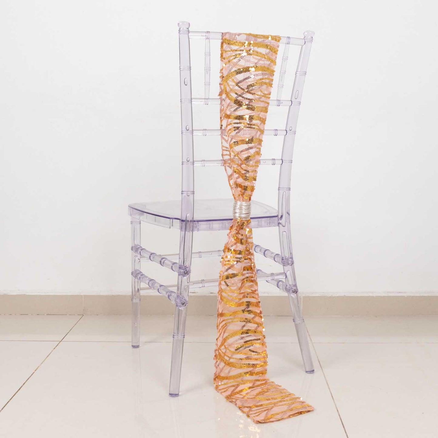 Rose gold mesh chair sash with gold wave embroidered sequins.
