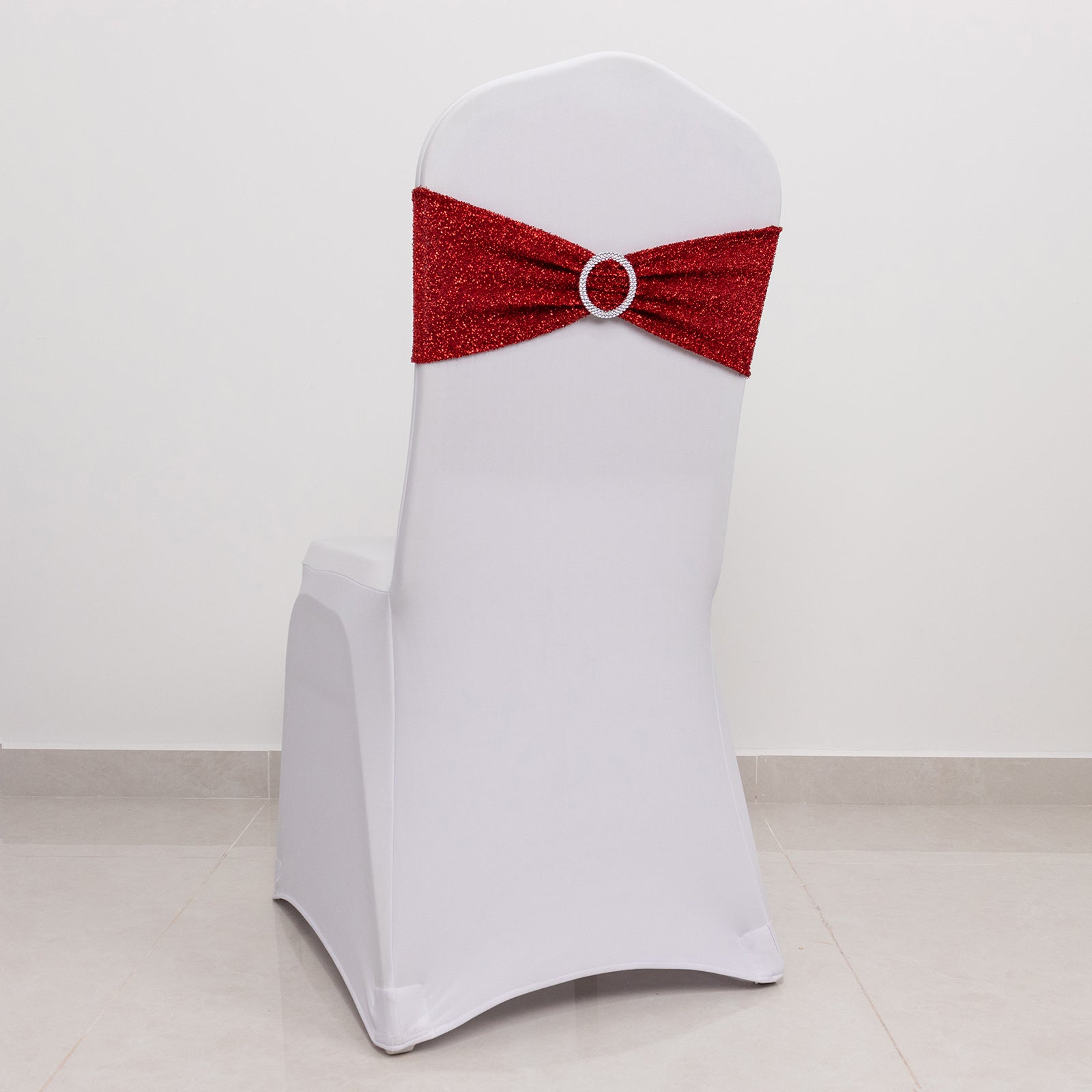 Red shimmer tinsel spandex stretch chair sash with silver rhinestone buckle.