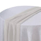 Beige chiffon table runner draped elegantly on a round table.