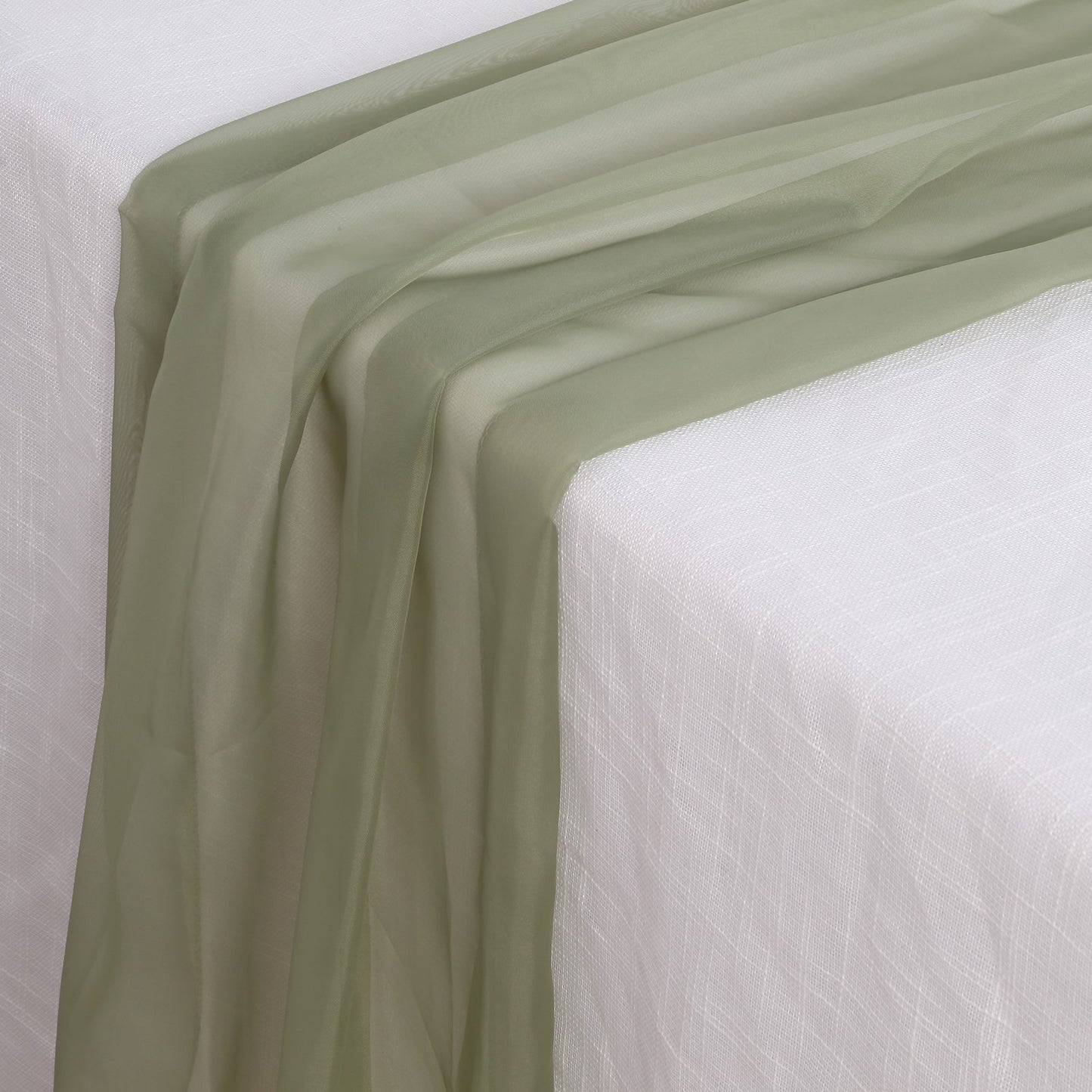 6ft Dusty Sage Green Chiffon Table Runner on a white table.