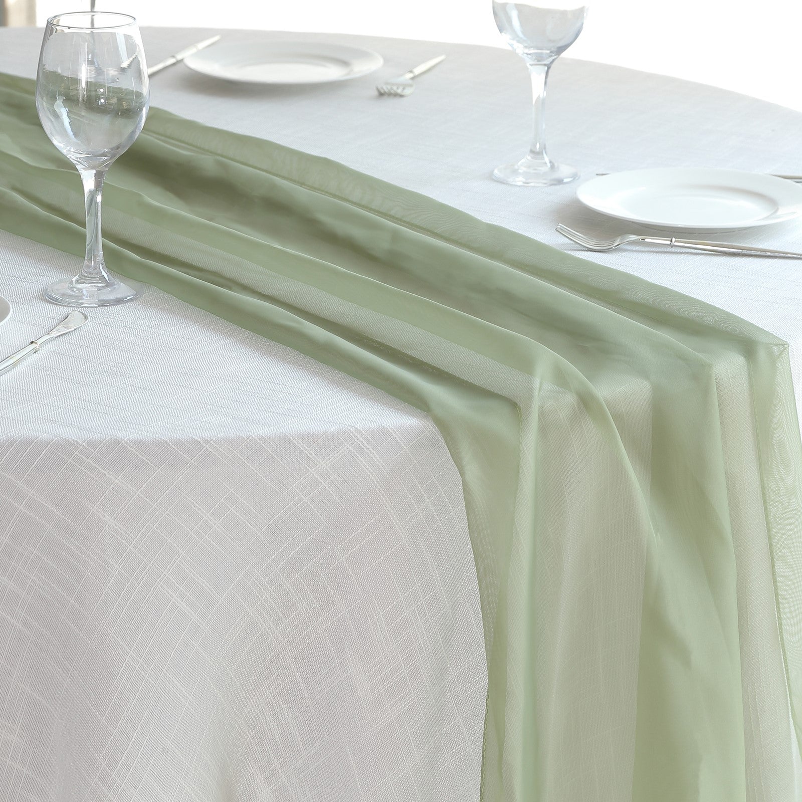 6ft Dusty Sage Green Chiffon Table Runner on a white tablecloth.