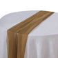 6ft gold chiffon table runner draped elegantly on a round table.