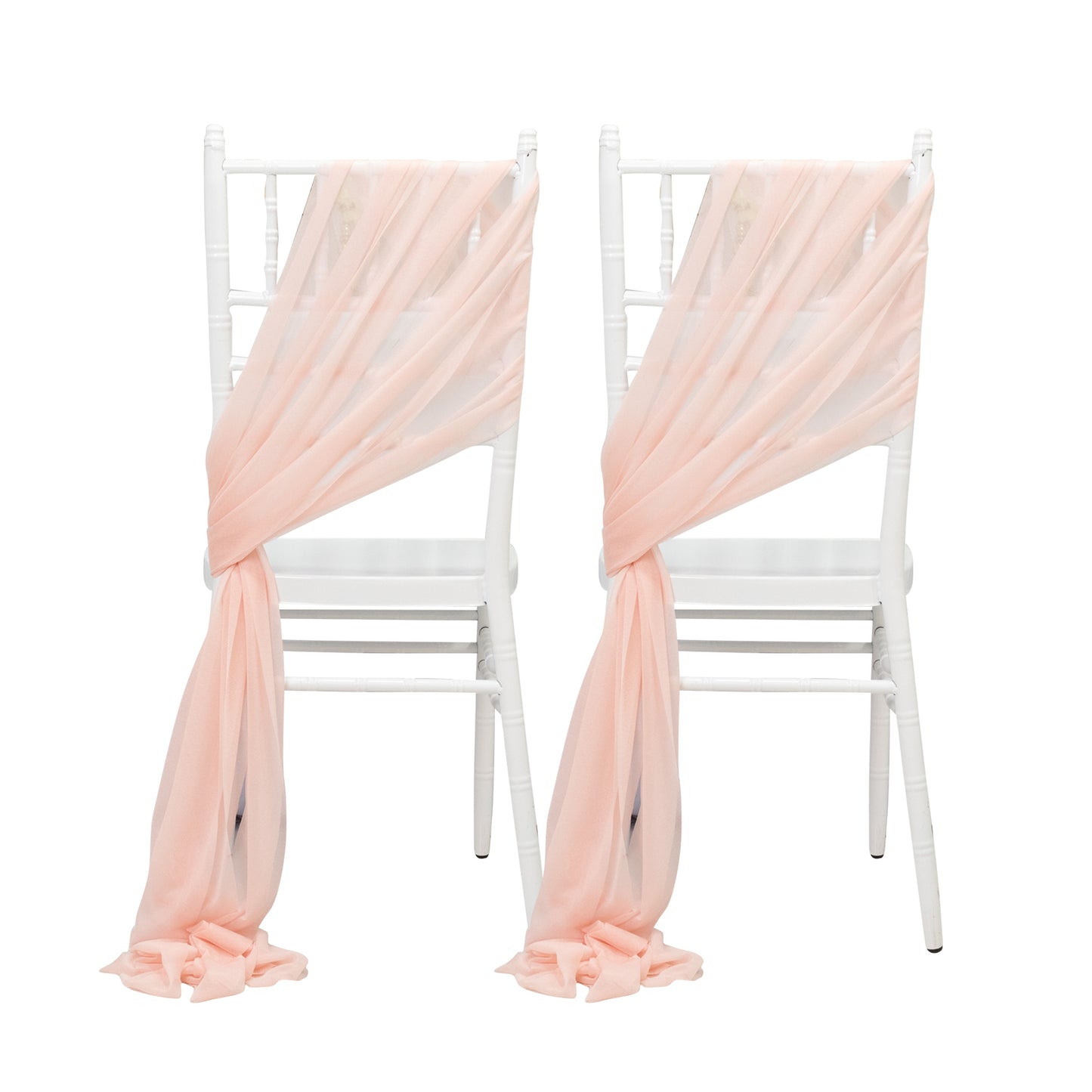 Blush sheer chair drapes elegantly styled on white chairs.