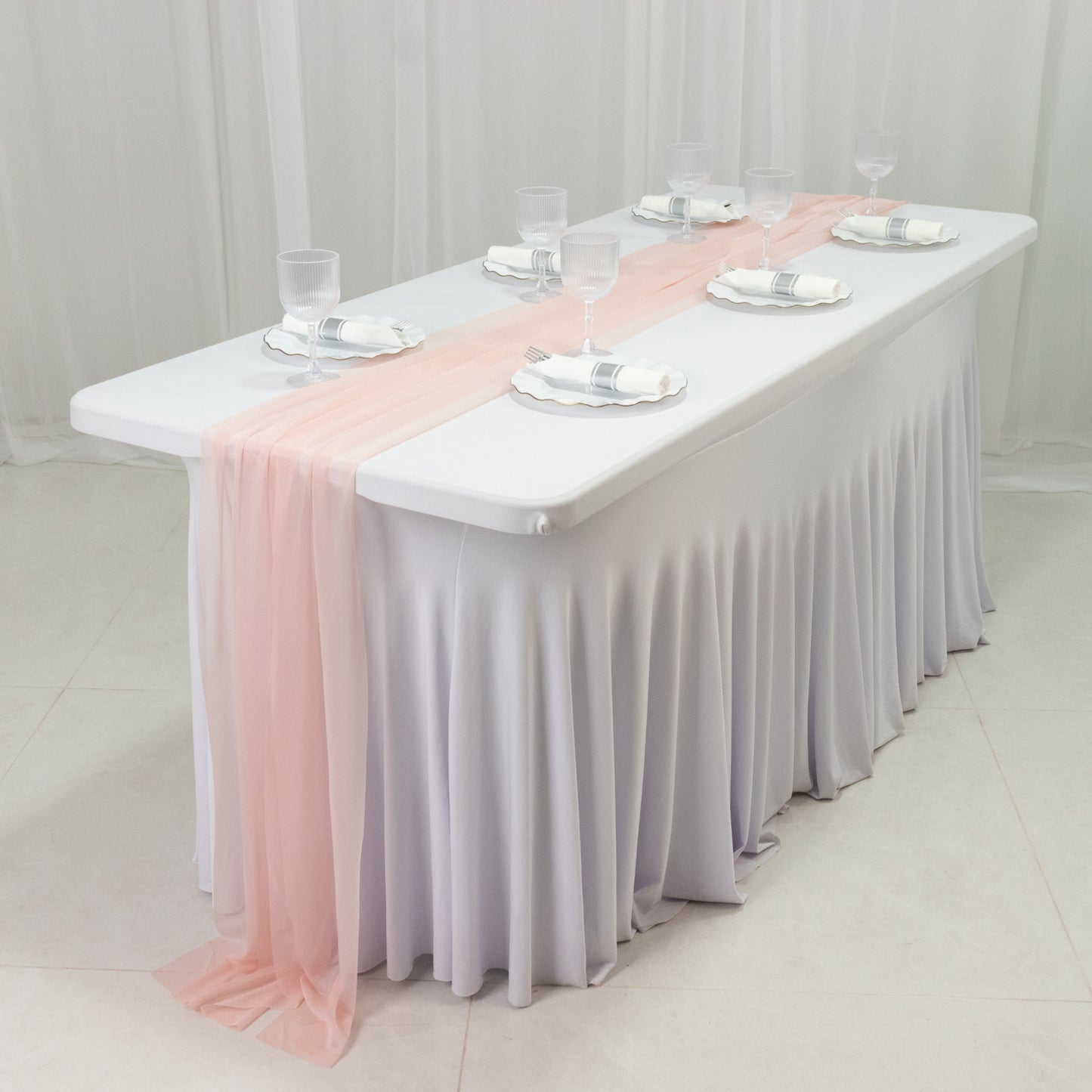Blush shimmer sheer table runners on a white table setting.