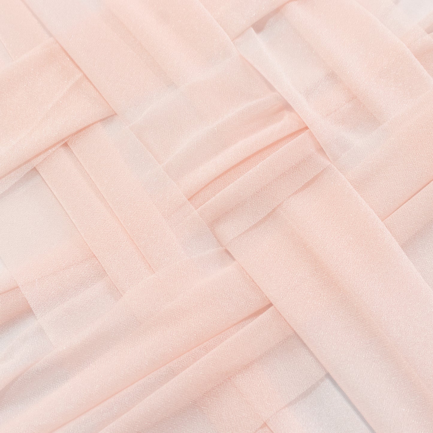 Blush shimmer sheer table runners in a woven pattern.