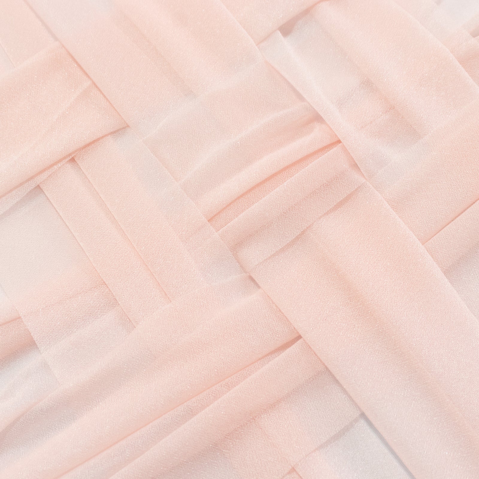 Blush shimmer sheer table runners in a woven pattern.