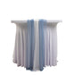 Dusty blue and ivory sheer table runners on a white table.